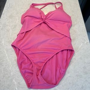 Bright pink cross-back one-piece swimsuit. Size 14. Excellent condition.